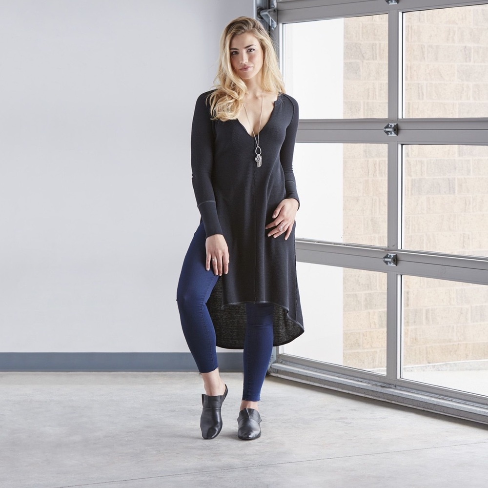 Free People long sleeve long black shirt with slit in one side. Size XS. NWT
